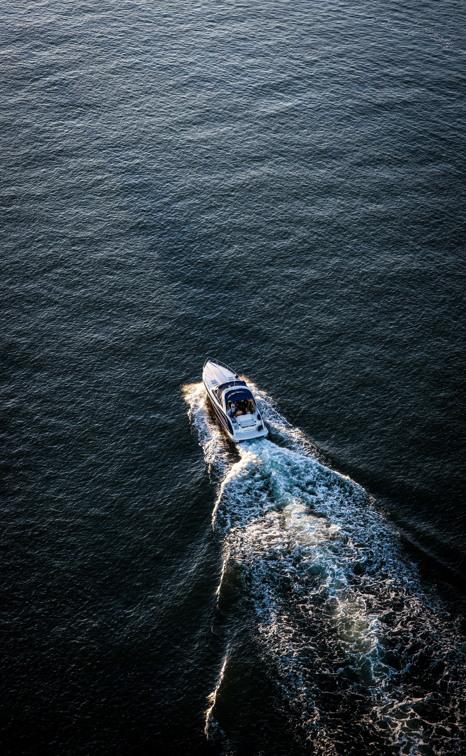 a boat traveling across a body of water, by Daniel Seghers, pexels contest winner, wide high angle view, 15081959 21121991 01012000 4k, afternoon sunlight, shot on sony a 7