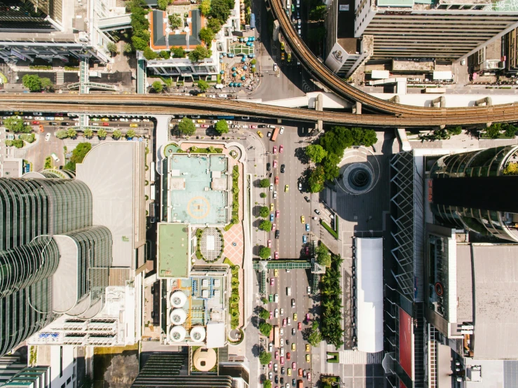 a view of a city from the top of a building, by Carey Morris, unsplash contest winner, bangkok townsquare, top view of convertible, uhd hyperdetailed photography, square