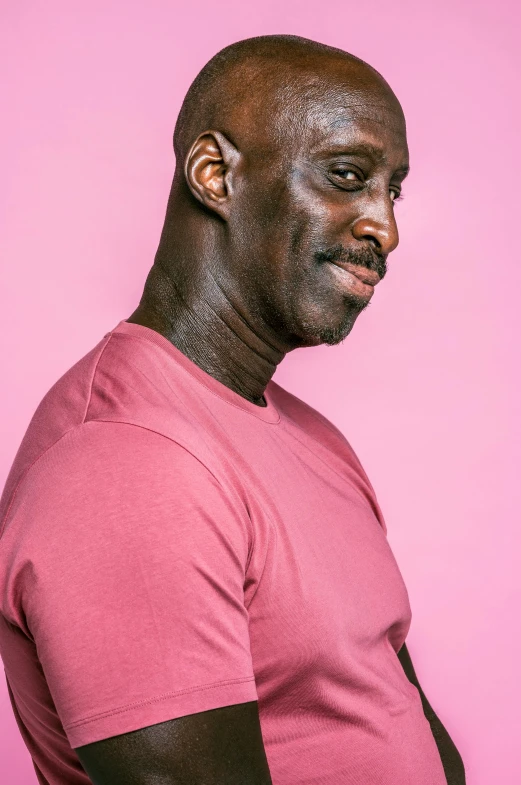 a man in a pink shirt on a pink background, pexels contest winner, les nabis, lance reddick, strong masculine features, gray men, black on white background