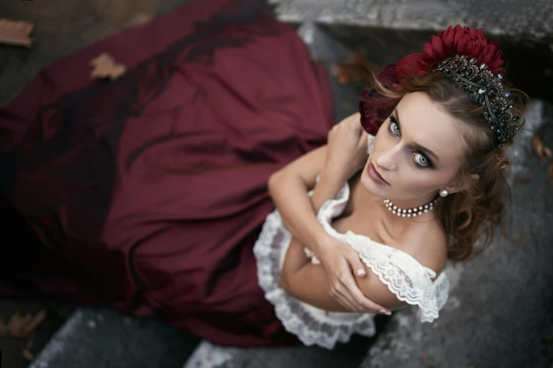 a woman in a red dress posing for a picture, a photo, inspired by Antoni Brodowski, purple eyes and white dress, victorian dress, a high angle shot, 5 0 0 px models