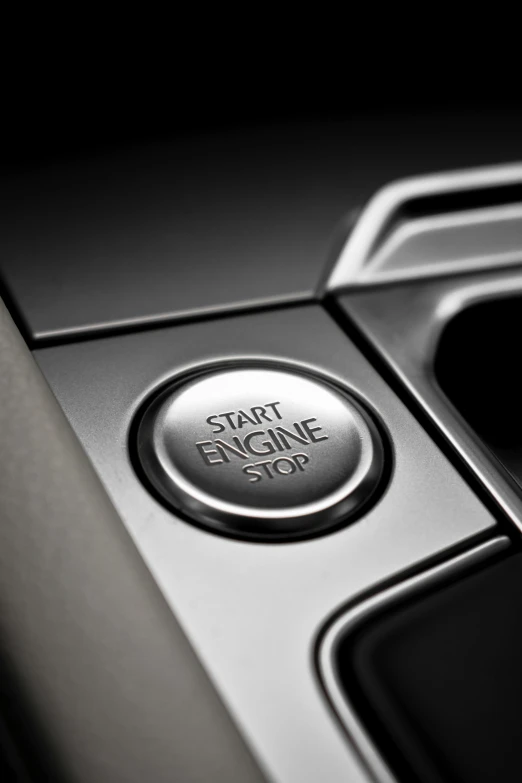 a black and white photo of a start engine button, ford fusion, digital image, thumbnail, crisp image