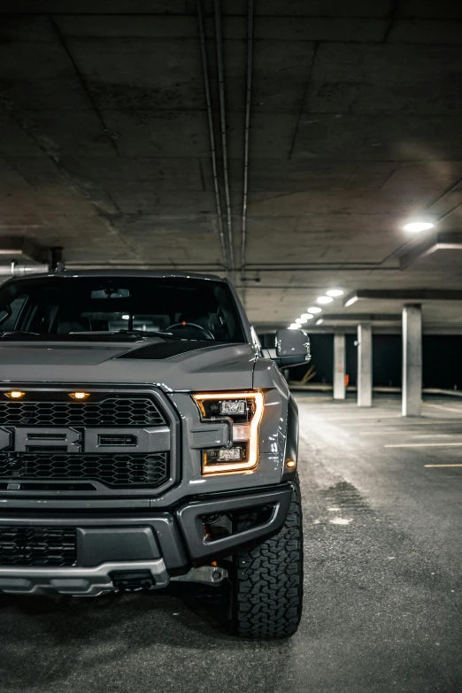 a ford f - 150 rap rap rap rap rap rap rap rap rap rap rap rap rap rap rap rap rap rap rap rap rap rap rap, a picture, by Daniel Seghers, pexels contest winner, set inside of parking garage, brown atmospheric lighting, gunmetal grey, rectangle