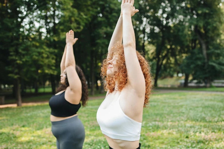 two women doing yoga in a park, trending on pexels, three hairy fat cave people, standing straight, thumbnail, upper body image