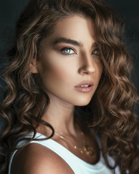 a beautiful young woman with long curly hair, a colorized photo, trending on pexels, hurufiyya, light brown hair blue eyes, gif, beauty retouch, glam photo