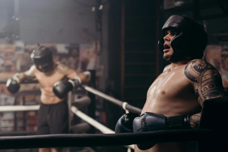 a close up of a person in a boxing ring, by Lee Gatch, happening, **cinematic, liam brazier, lachlan bailey, ( ( theatrical ) )