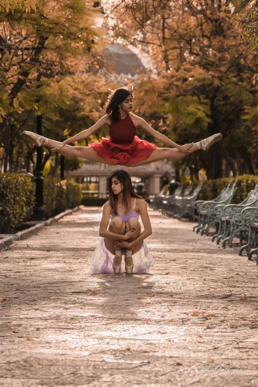 a man and a woman doing acrobatics in a park, a portrait, by Luis Molinari, pexels contest winner, arabesque, two girls, tlaquepaque, (fantasy), square