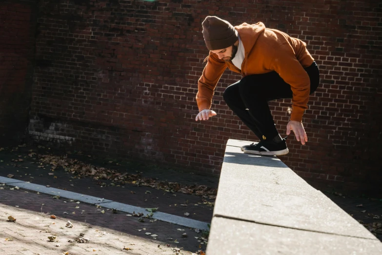 a man riding a skateboard up the side of a wall, by Jan Tengnagel, unsplash, parkour, autumnal, brick, 15081959 21121991 01012000 4k