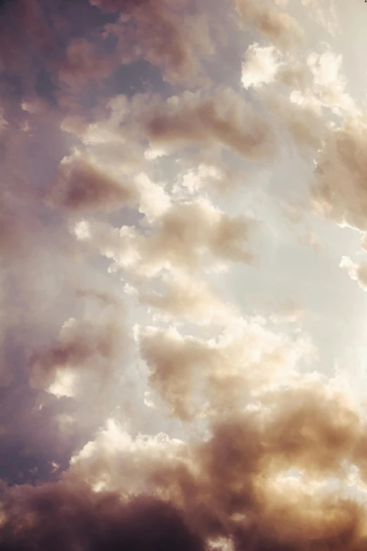 a large jetliner flying through a cloudy sky, an album cover, by James Morris, unsplash, romanticism, soft sunlight dappling, mammatus clouds, detailed clouds, soft sepia tones