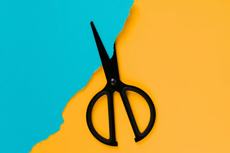 a pair of black scissors on a yellow and blue background, trending on pexels, superflat, orange and teal color, cut-scene, julian ope, cut out