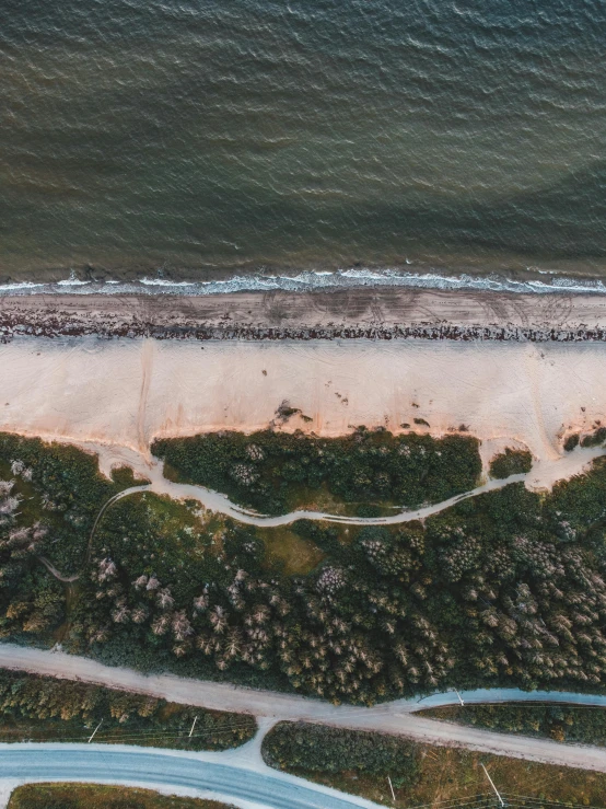 an aerial view of a beach next to a body of water, by Adam Marczyński, 4k image”, high quality image”, gigapixel photo, 4k)