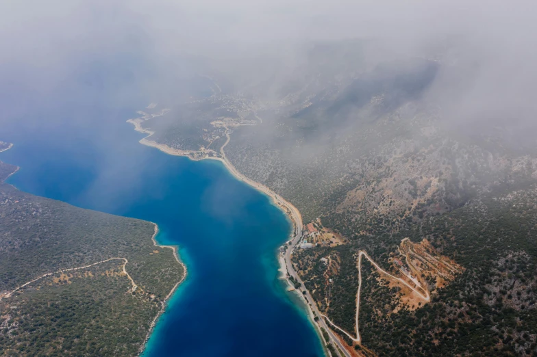 an aerial view of a large body of water, pexels contest winner, hurufiyya, greek nose, misty weather, high quality product image”, thumbnail