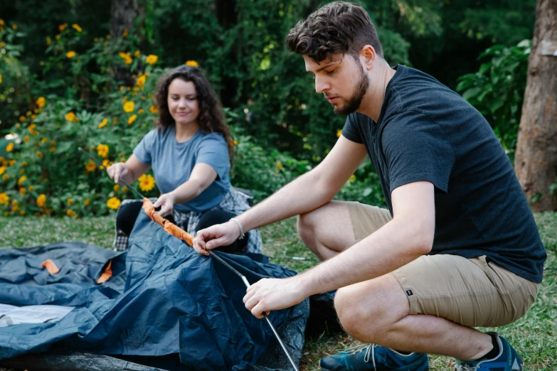 a man and a woman setting up a tent, by Emma Andijewska, happening, avatar image, college, foliage clothing, thumbnail