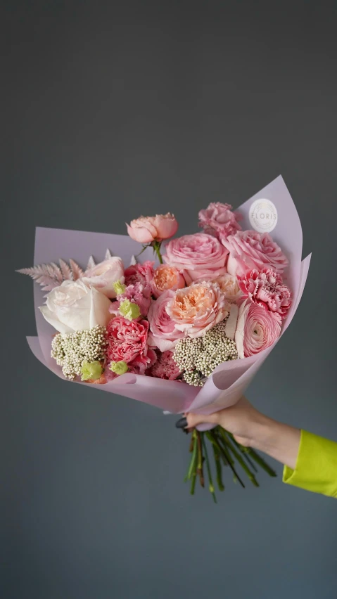 a woman holding a bouquet of pink and white flowers, inspired by François Boquet, instagram, on a gray background, sherbert sky, sweet hugs, made of glazed