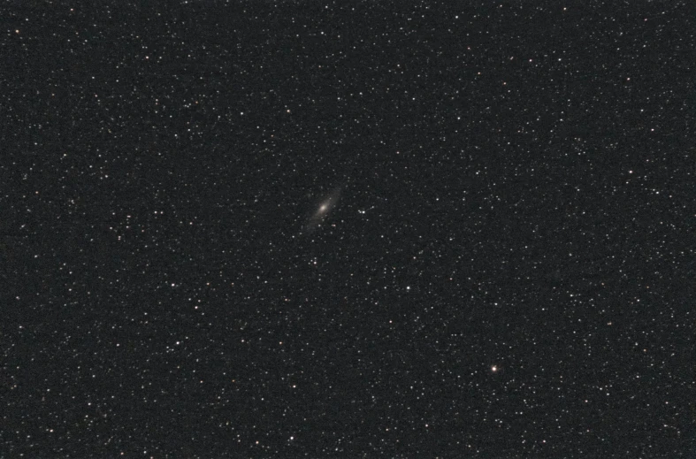 a black sky filled with lots of stars, an album cover, by Vija Celmins, andromeda galaxy, low quality grainy, lone female, medium long shot