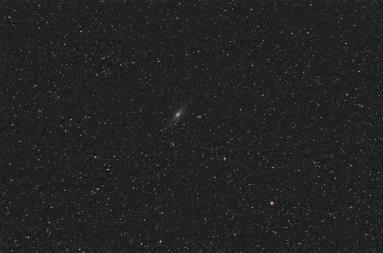 a black sky filled with lots of stars, an album cover, by Vija Celmins, andromeda galaxy, low quality grainy, lone female, medium long shot