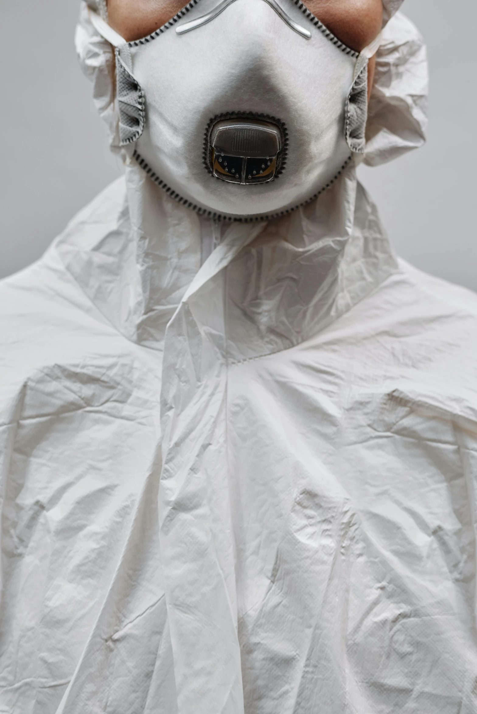 a man wearing a protective suit and a gas mask, reddit, hyperrealism, white cloth, neck zoomed in, 155 cm tall, hyperrealistic n- 4