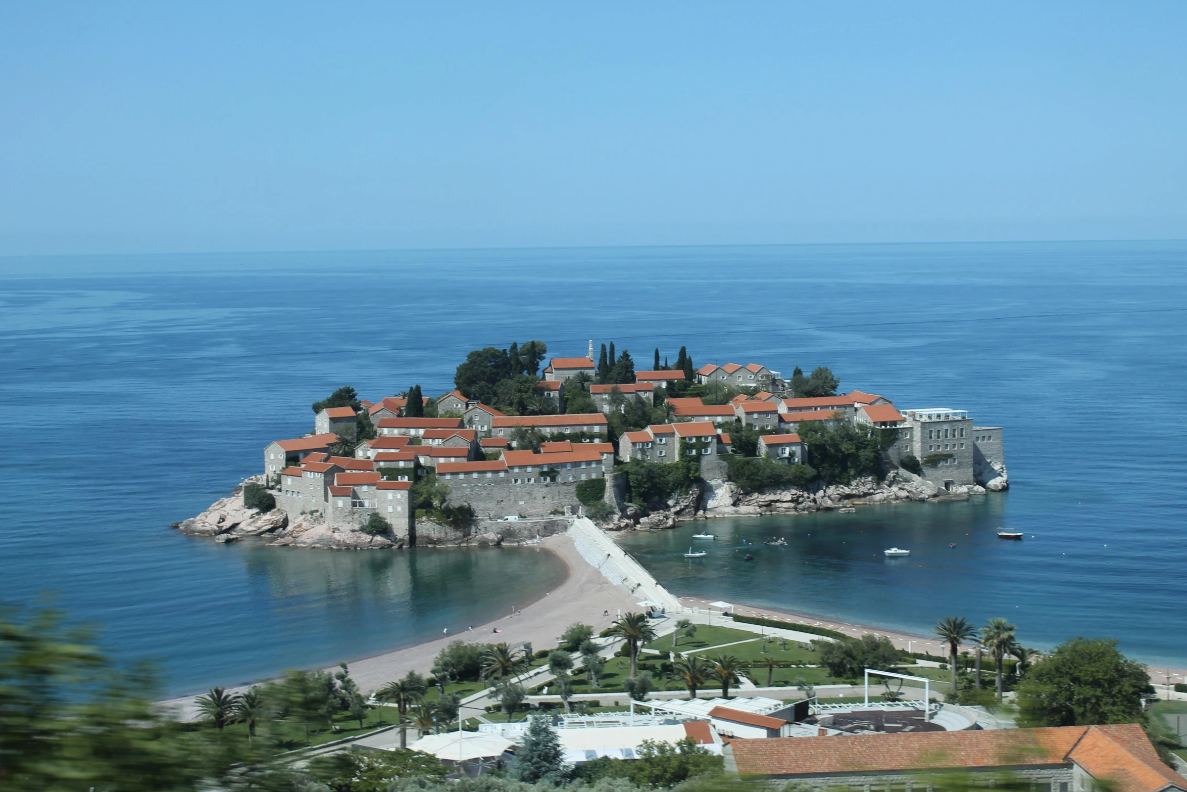 a small island in the middle of the ocean, by Jan Rustem, pexels contest winner, renaissance, white buildings with red roofs, фото девушка курит, totalitarian prison island, july 2 0 1 1