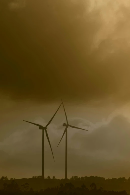 a couple of wind turbines sitting on top of a lush green field, a picture, by Jan Tengnagel, sand storm enters, ap news photograph, 15081959 21121991 01012000 4k