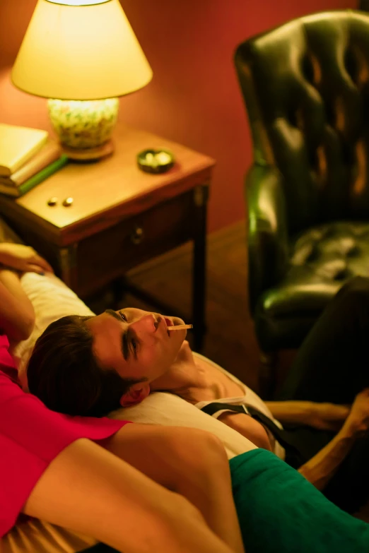 a man and woman laying on a bed next to a dog, inspired by Nan Goldin, happening, gentleman's club lounge, **cinematic, zachary quinto, robert sheehan