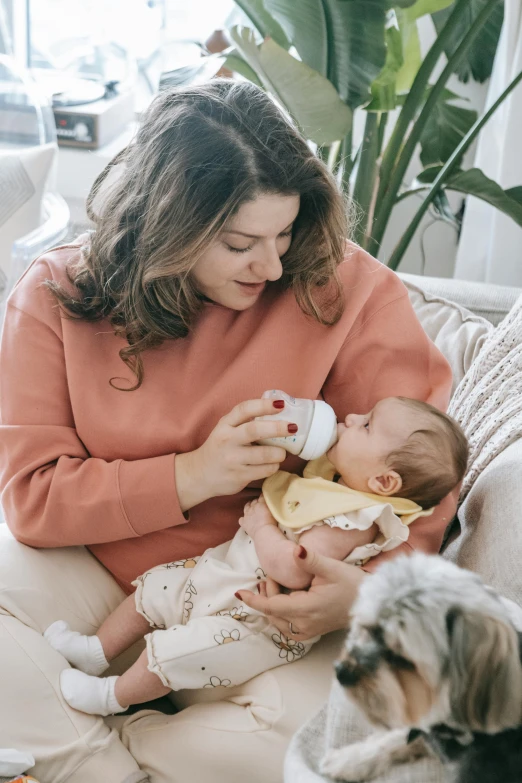 a woman sitting on a couch feeding a baby, pexels contest winner, renaissance, wearing a cute top, bottle, manuka, profile image