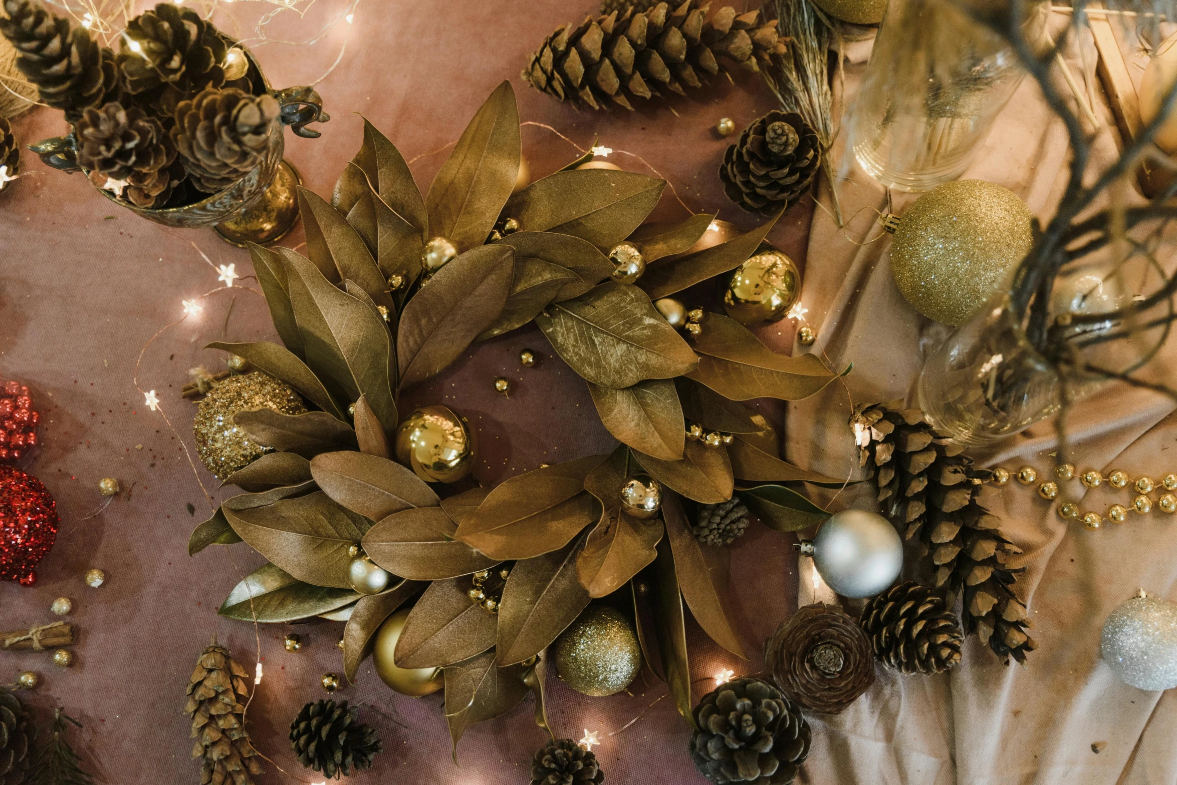 a close up of a wreath on a table, by Carey Morris, pexels contest winner, baroque, brown and gold, thumbnail, flat lay, multiple stories