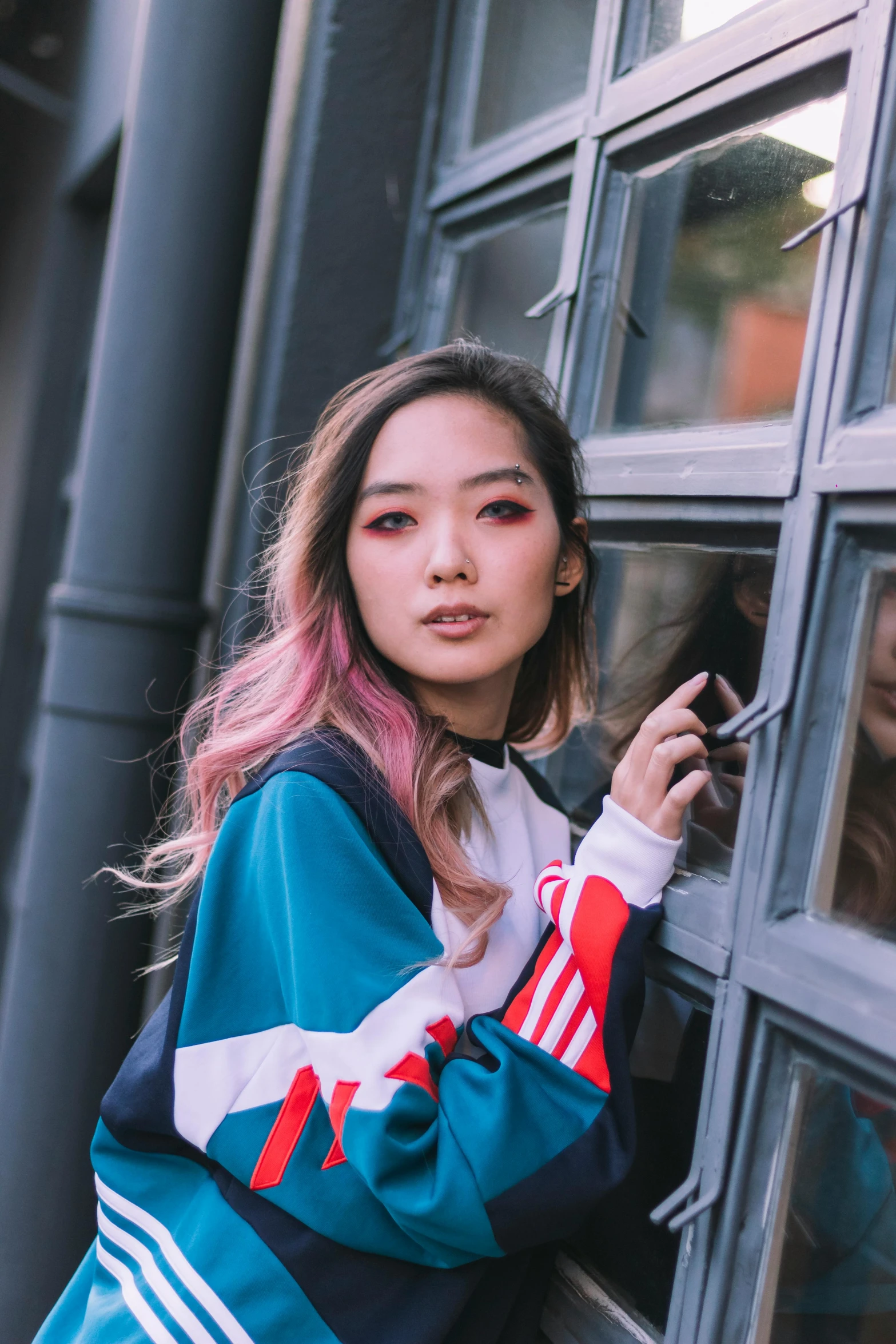 a woman with pink hair leaning against a window, inspired by Yanjun Cheng, unsplash, woman in streetwear, wavy hair spread out, asian features, colour blocking
