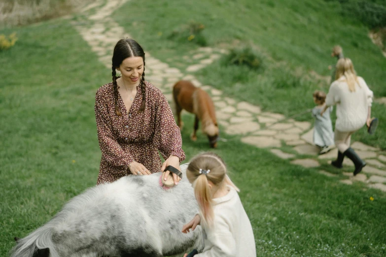 a woman and a little girl petting a horse, by Emma Andijewska, pexels contest winner, renaissance, avatar image, in the hillside, casual game, cafe for felted animals