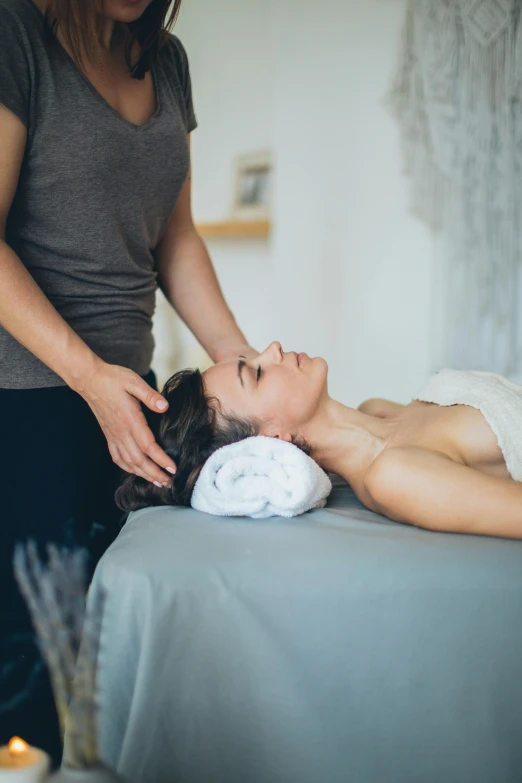 a woman getting a massage at a spa, a portrait, by Gavin Hamilton, unsplash, caucasian, studio photo, san francisco, bedhead