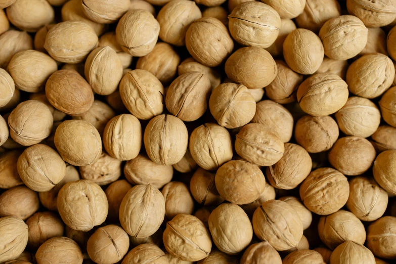 a pile of nuts sitting on top of a table, light brown, thumbnail, fruit, uncrop