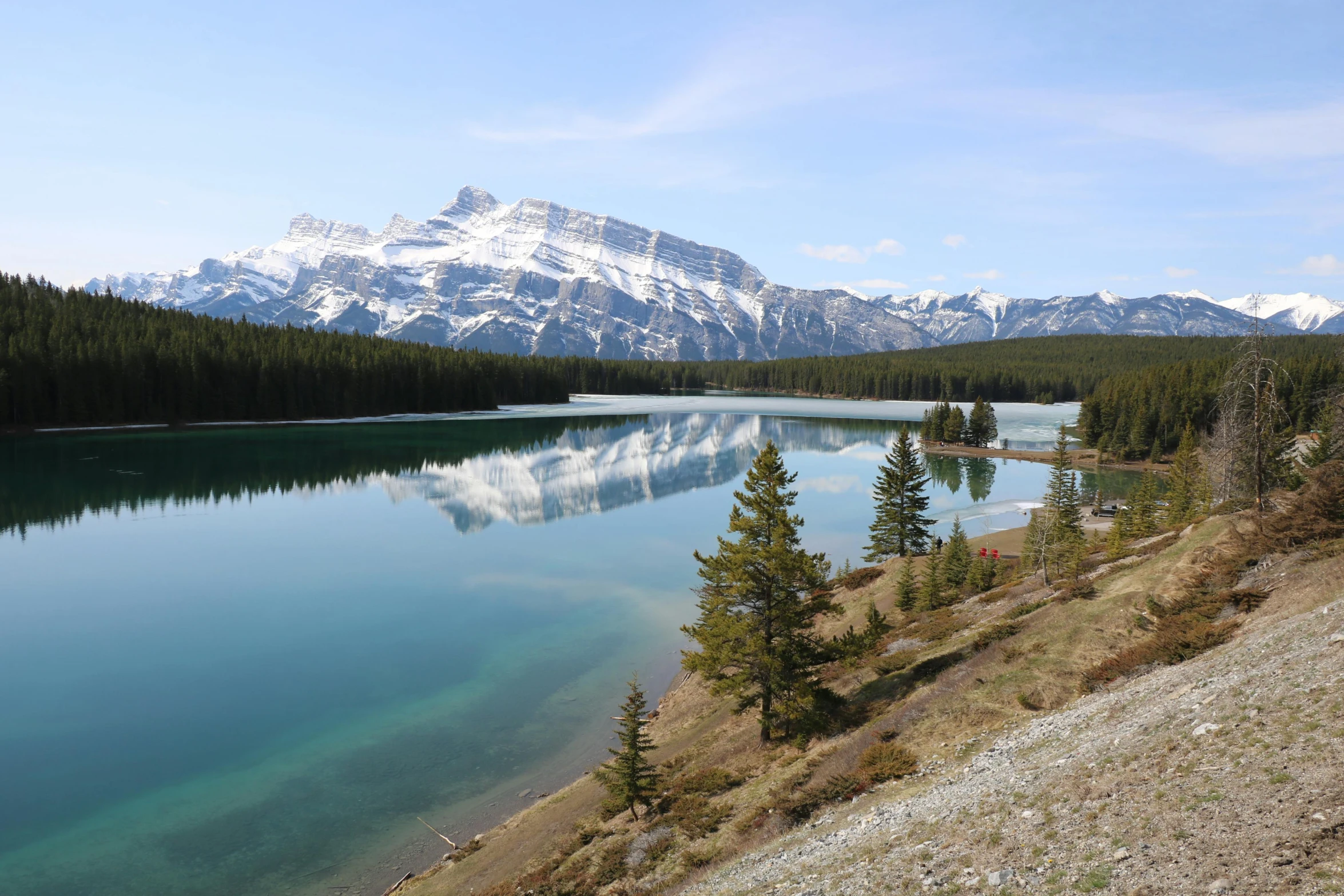 a body of water with mountains in the background, by Brigette Barrager, pexels contest winner, hurufiyya, banff national park, avatar image