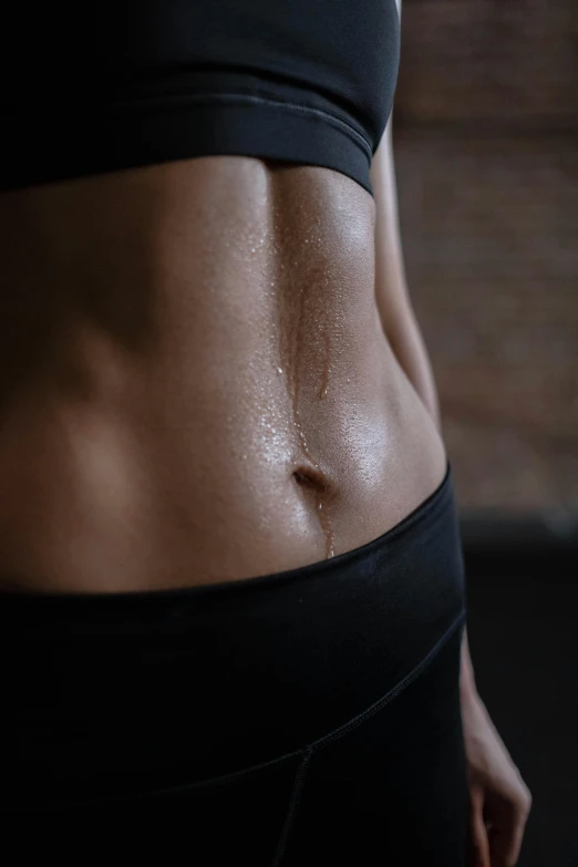 a close up of a woman's stomach, pexels contest winner, athletic muscle tone, drip, lit from the side, hypersphere