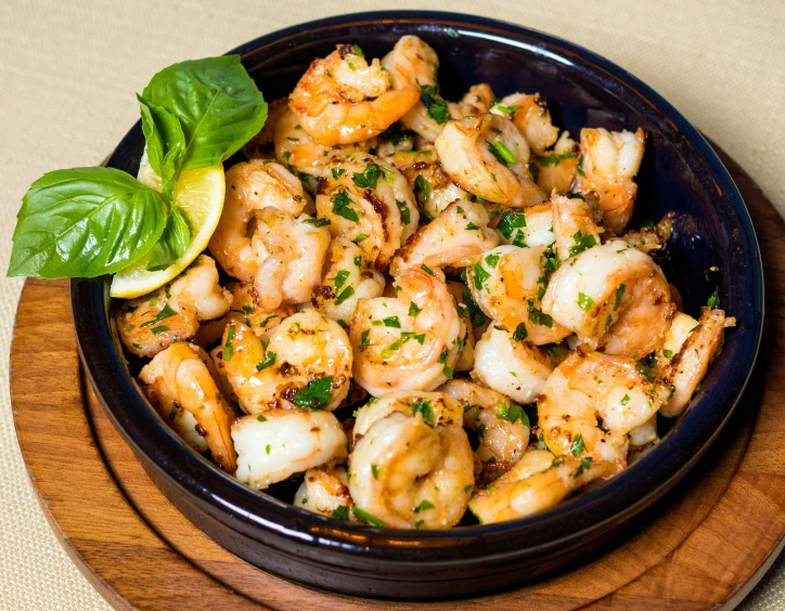 a bowl filled with shrimp sitting on top of a wooden plate, renaissance, fan favorite, basil gogos, thumbnail, hot food