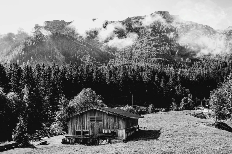 a black and white photo of a cabin in the mountains, a black and white photo, by Karl Walser, pexels, modernism, farming, amidst of nature fully covered, photographic print, morning time