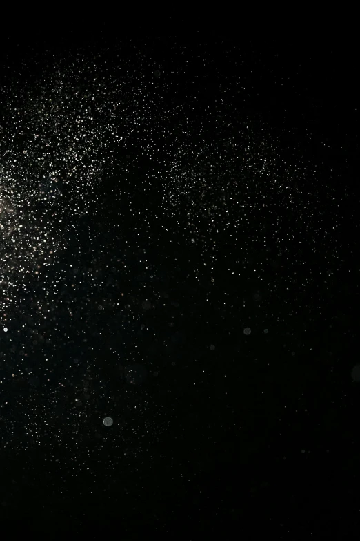 a snowboarder performs a trick in the air, an album cover, by Jacob Toorenvliet, pexels, light and space, glitter gif, black background with stars, grainy footage, background image