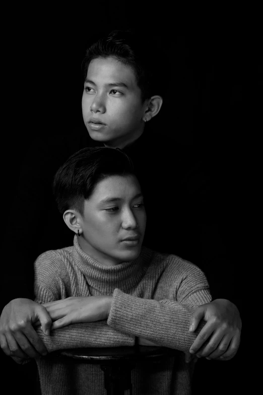 a couple of men sitting next to each other, a black and white photo, inspired by Wang Duo, unsplash, realism, studio potrait, boy, kuntilanak, 2 people