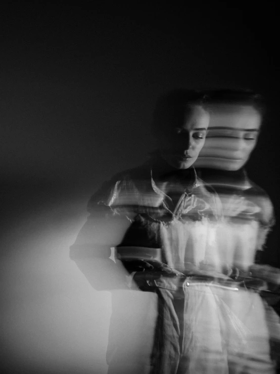 a black and white photo of a woman in a dress, by Emma Andijewska, unsplash, surrealism, blurry and glitchy, some light reflexions, studio medium format photograph, portrait!!!