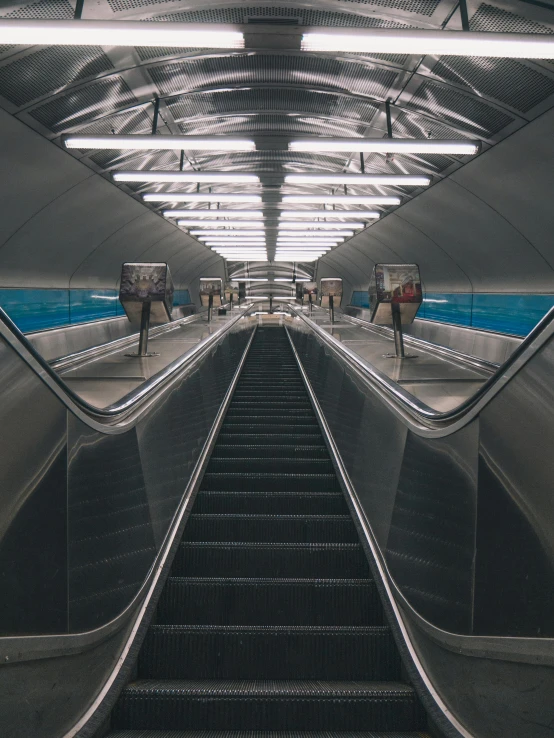 a view of an escalator in a subway station, unsplash contest winner, hypermodernism, instagram story, spanish, hyperrealism photo, ilustration