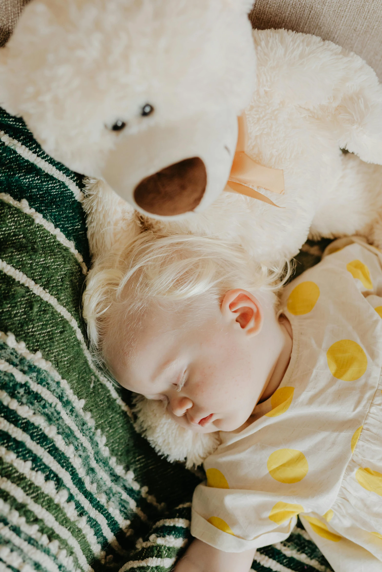 a baby sleeping next to a white teddy bear, pexels contest winner, intense albino, a blond, toddler, retro vibe