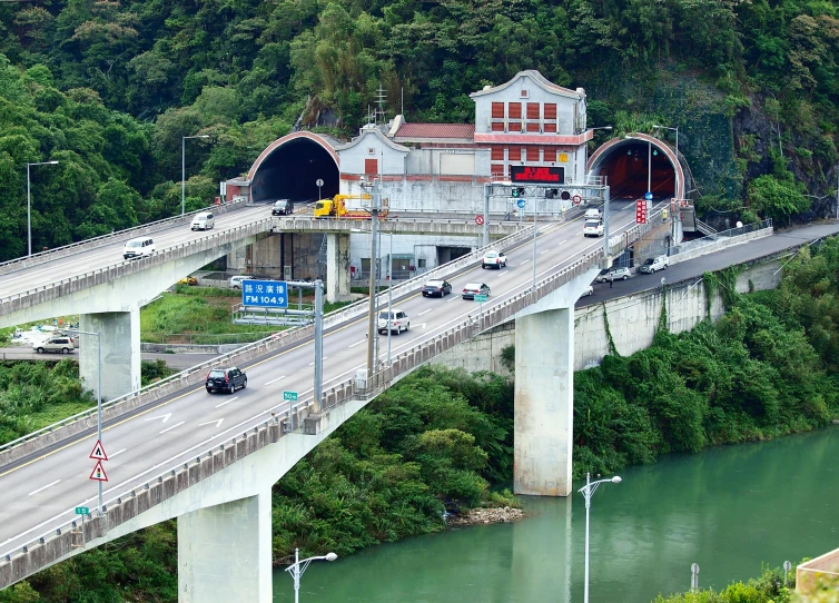 a bridge over a river with cars driving on it, jin shan, high walled tunnel, thumbnail, hziulquoigmnzhah