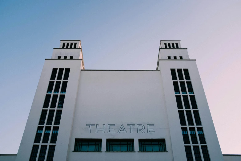 a large white building with a blue sky in the background, an art deco sculpture, unsplash contest winner, war theatre, elstree, ignant, frank moth