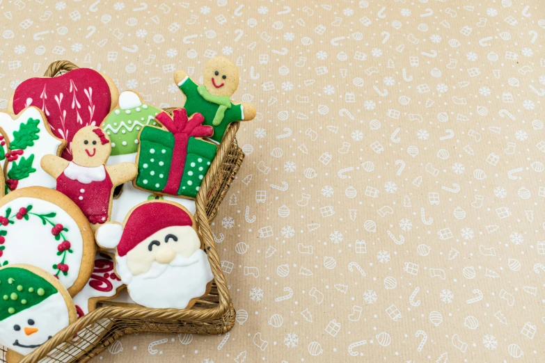 a basket filled with christmas cookies on top of a table, by Hiroshi Honda, pexels, figuration libre, background image, multicoloured, square, cute:2