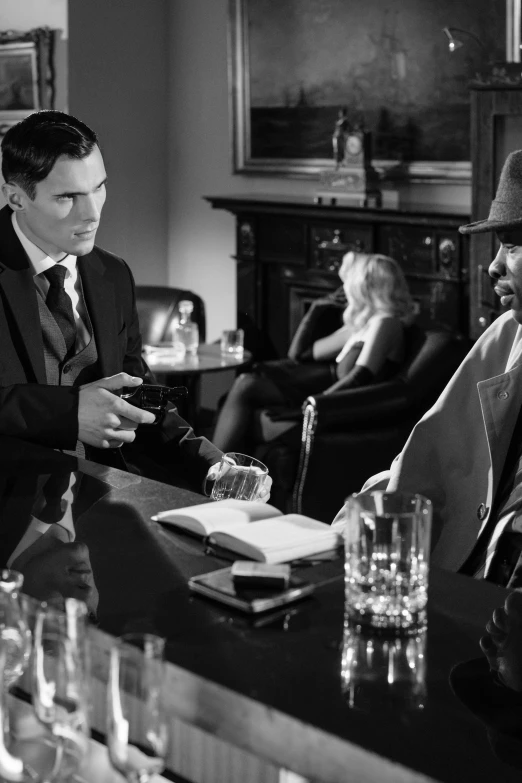 a black and white photo of two men sitting at a bar, purism, olivia pope, film noir style, deerstalker, dream sequence. the apprentice
