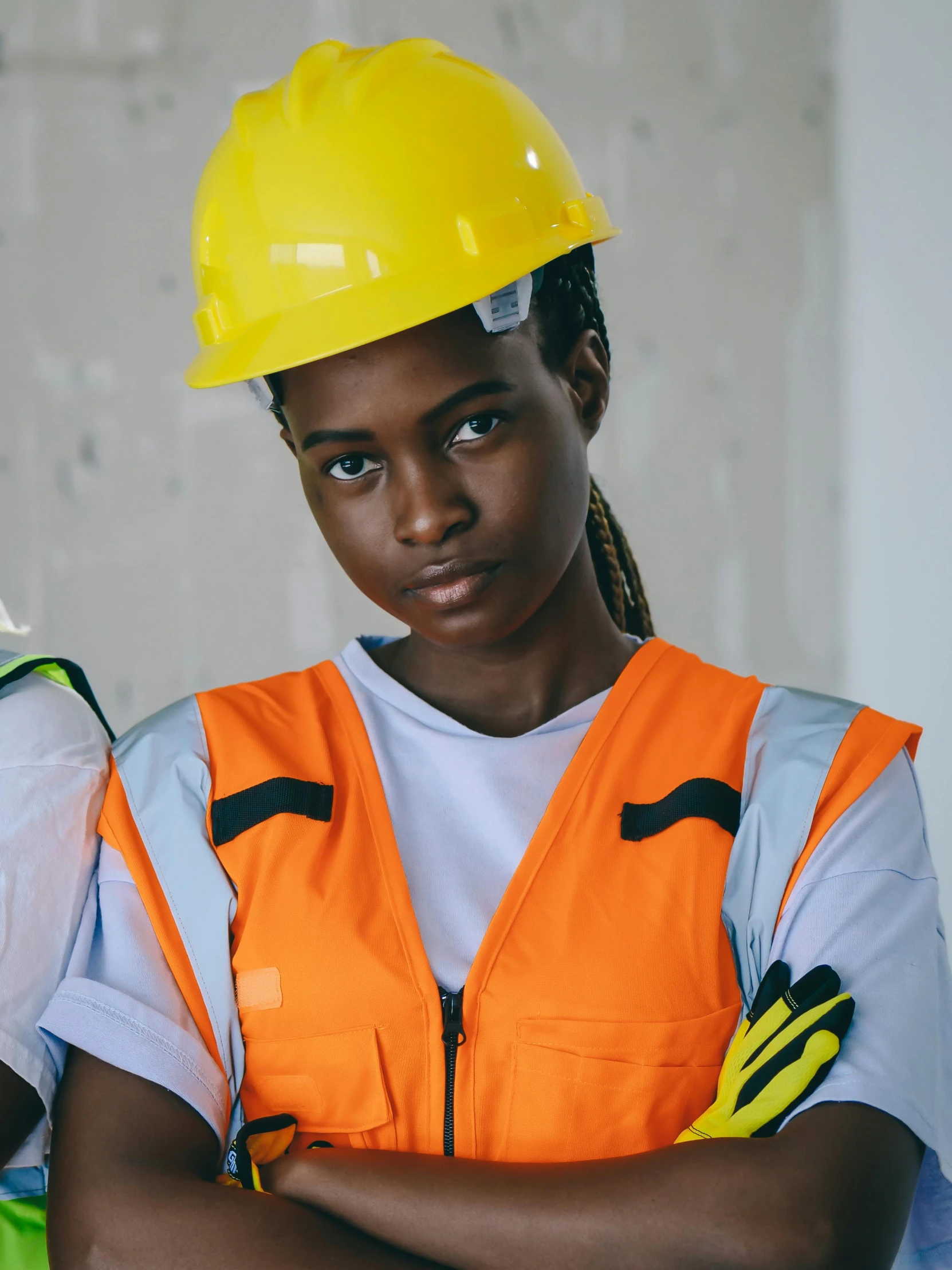 two female construction workers standing next to each other, inspired by Afewerk Tekle, trending on pexels, portrait willow smith, nonbinary model, thumbnail, attractive photo