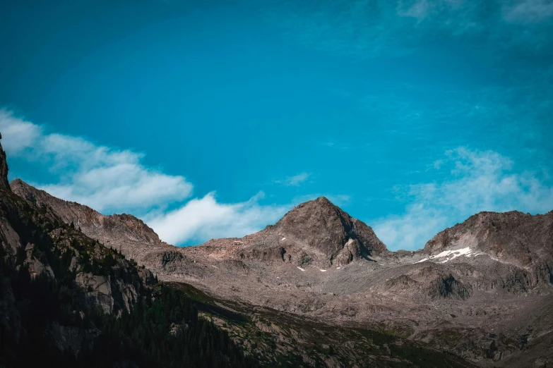 a mountain range with a blue sky in the background, pexels contest winner, brown, whistler, screensaver, large format picture