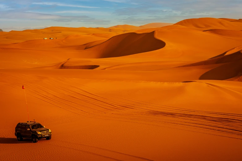 a car that is sitting in the sand, hurufiyya, thumbnail, majestic dunes, red ocher, dessert