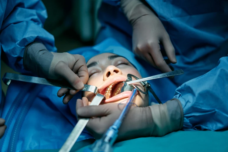 a close up of a person with an open mouth, chinese surgery operating table, square jaw-line, istock, fan favorite