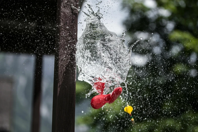 a fire hydrant spewing water on a fire hydrant, by Doug Ohlson, pexels contest winner, photorealism, venom dunking on spiderman, parkour, color ( sony a 7 r iv, the red ninja