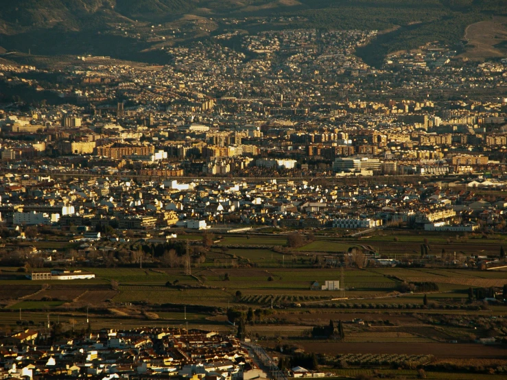 an aerial view of a city with mountains in the background, by Giuseppe Camuncoli, pexels contest winner, renaissance, andres gursky, jerez, low detail, panels