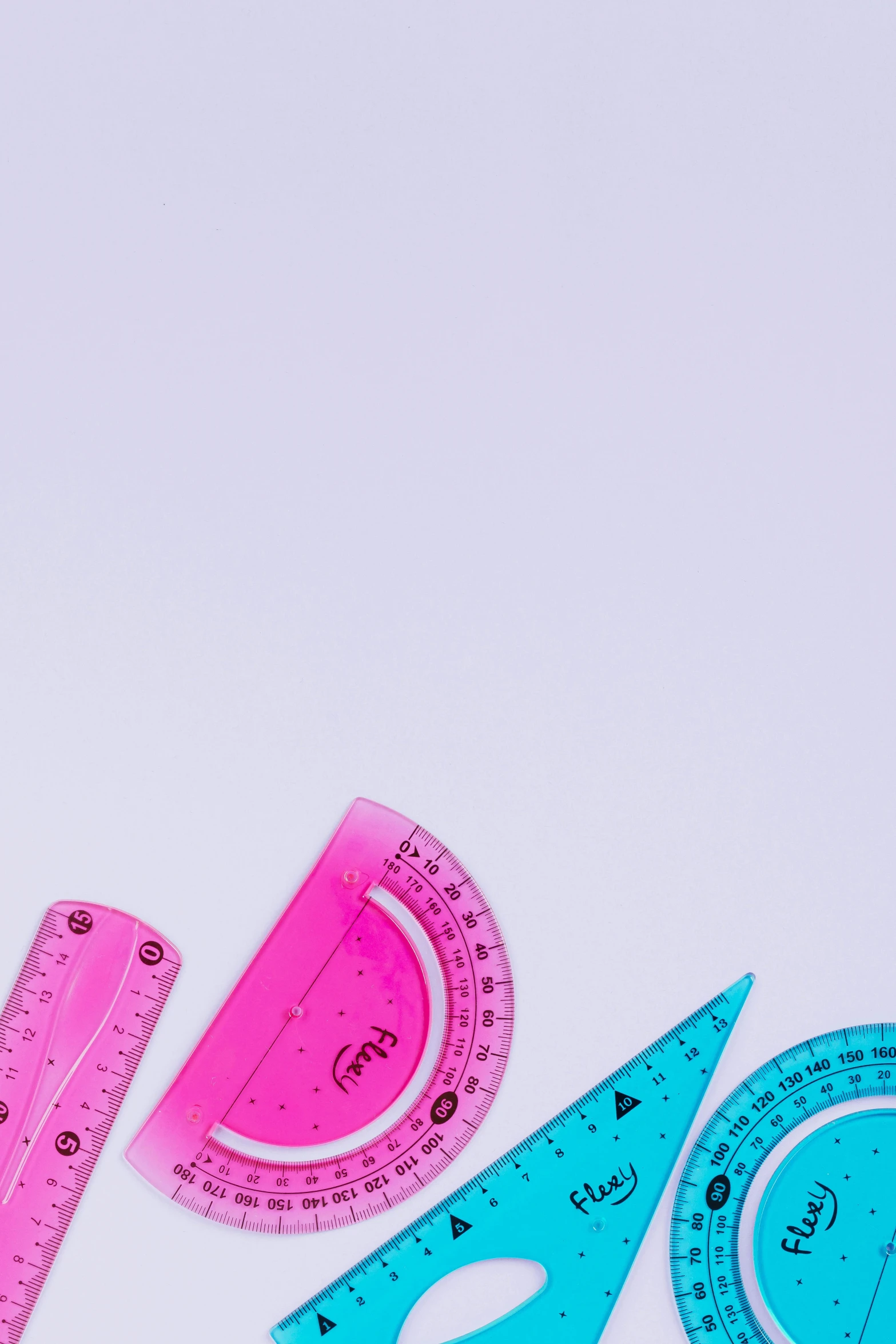 a group of tools sitting on top of a white surface, by Julian Allen, trending on pexels, in the colors hot pink and cyan, math art, arcs, schools