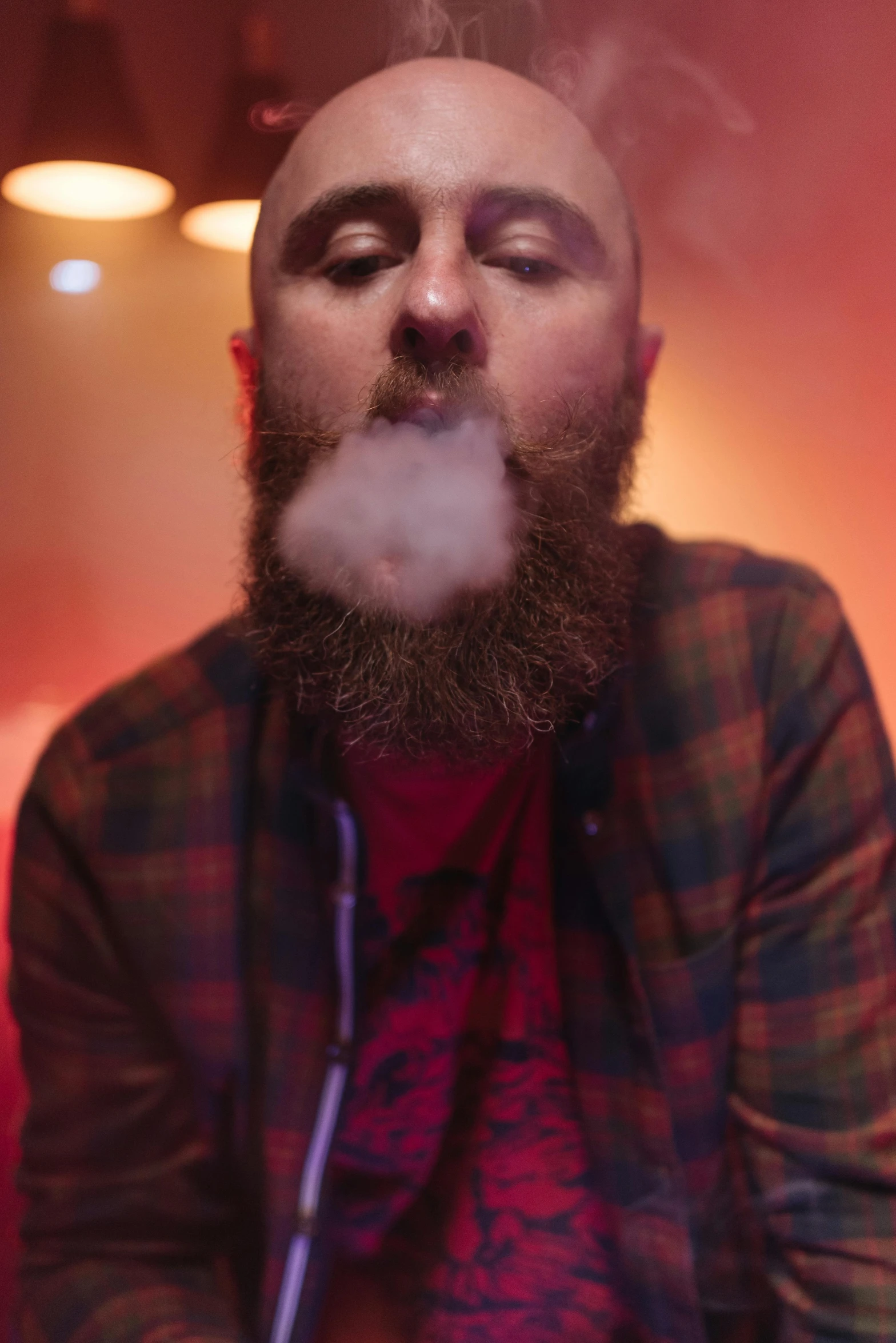 a man with a beard smoking a cigarette, an album cover, inspired by Brian 'Chippy' Dugan, unsplash, shaved head, lights and smoke, mac miller, photo from a promo shoot